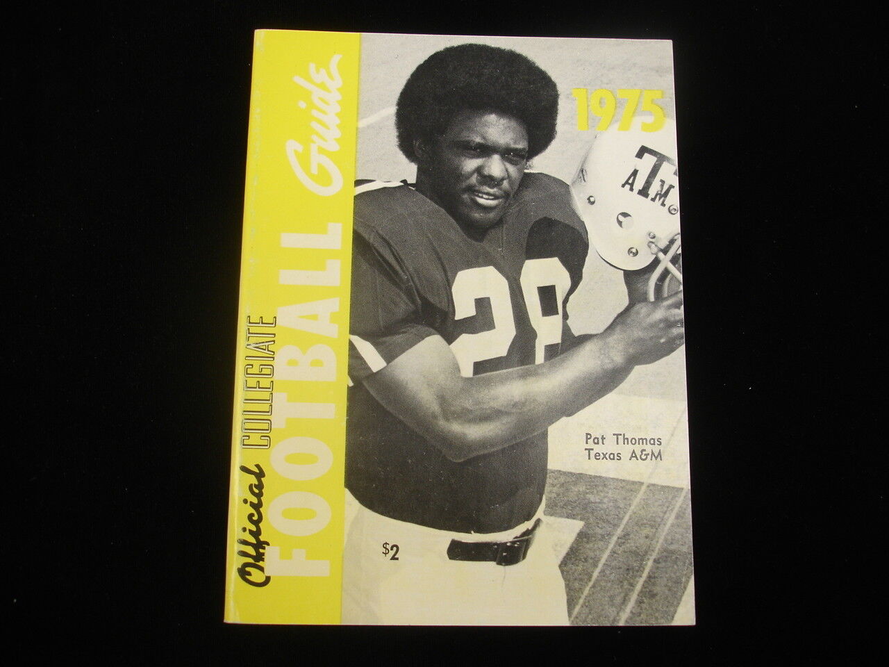 1975 Official NCAA Football Guide - Pat Thomas Cover